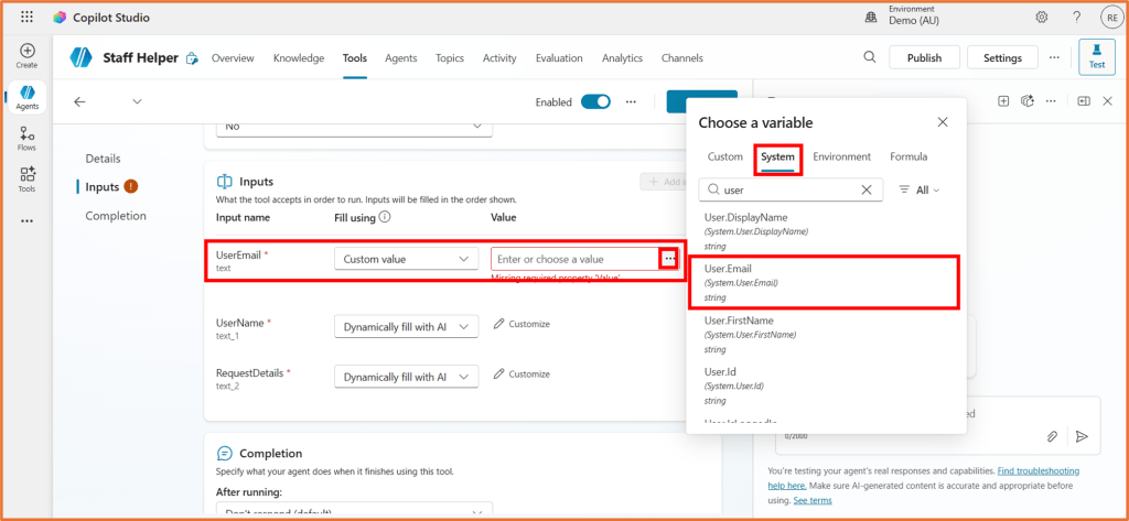 Screenshot of Copilot Studio showing the Staff Helper interface with Inputs section, highlighting UserEmail input field and dropdown for selecting a variable.